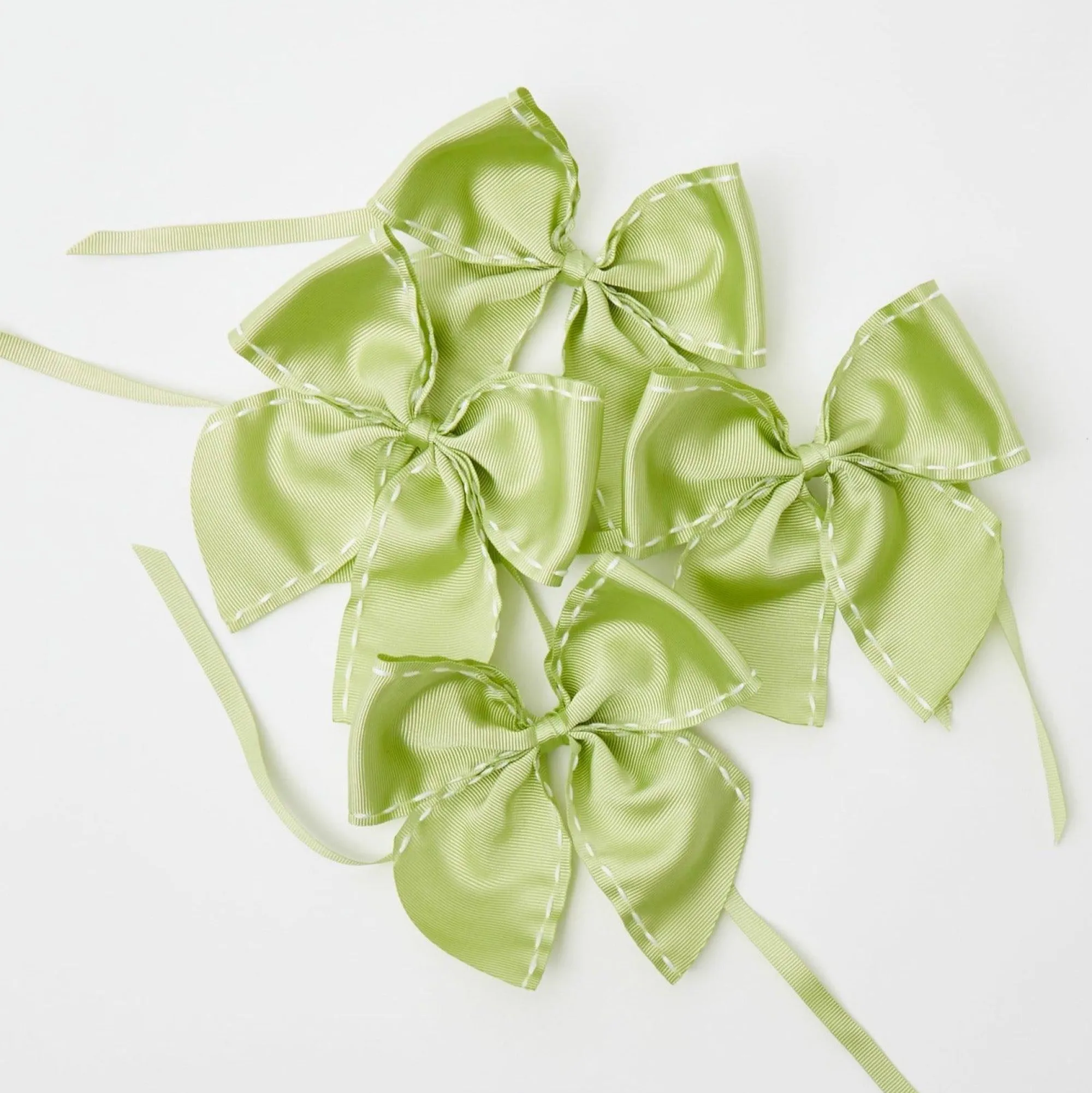 green_saddle_stitch_napki_9.webp Clearance Green Saddle Stitch Napkin Bows (Set Of 4) Napkin Rings, Bows & Wreaths